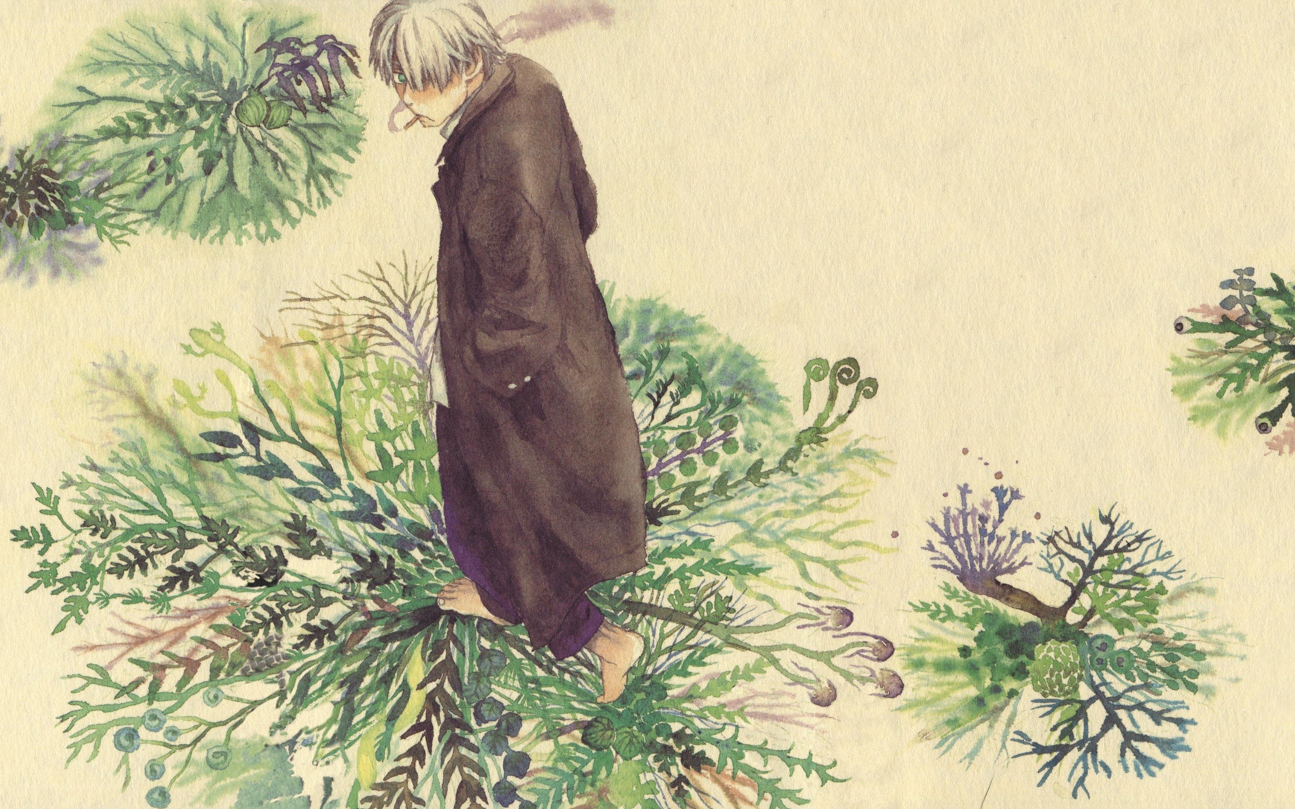 man in coat among plants