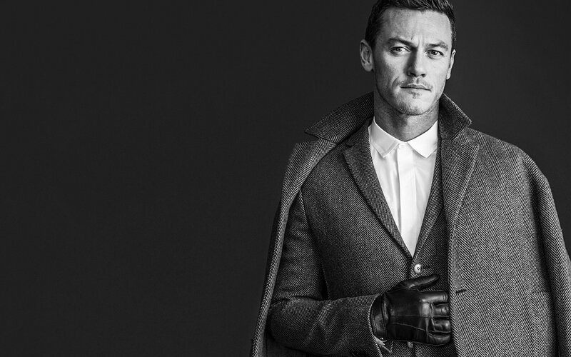 man in coat and gloves
