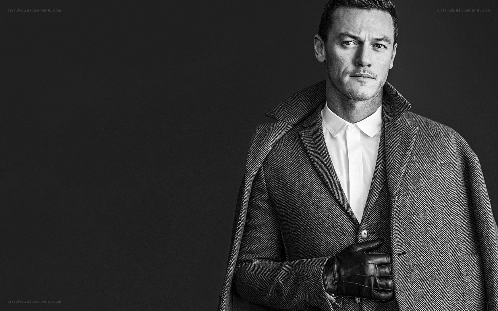 man in coat and gloves