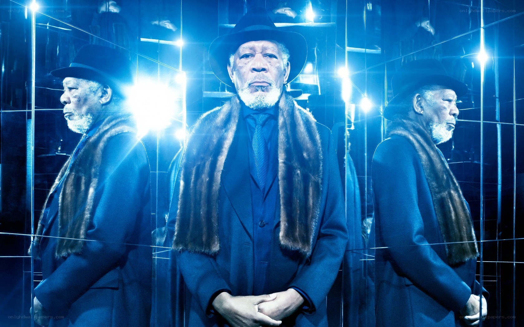 Man in coat and hat with mirrors
