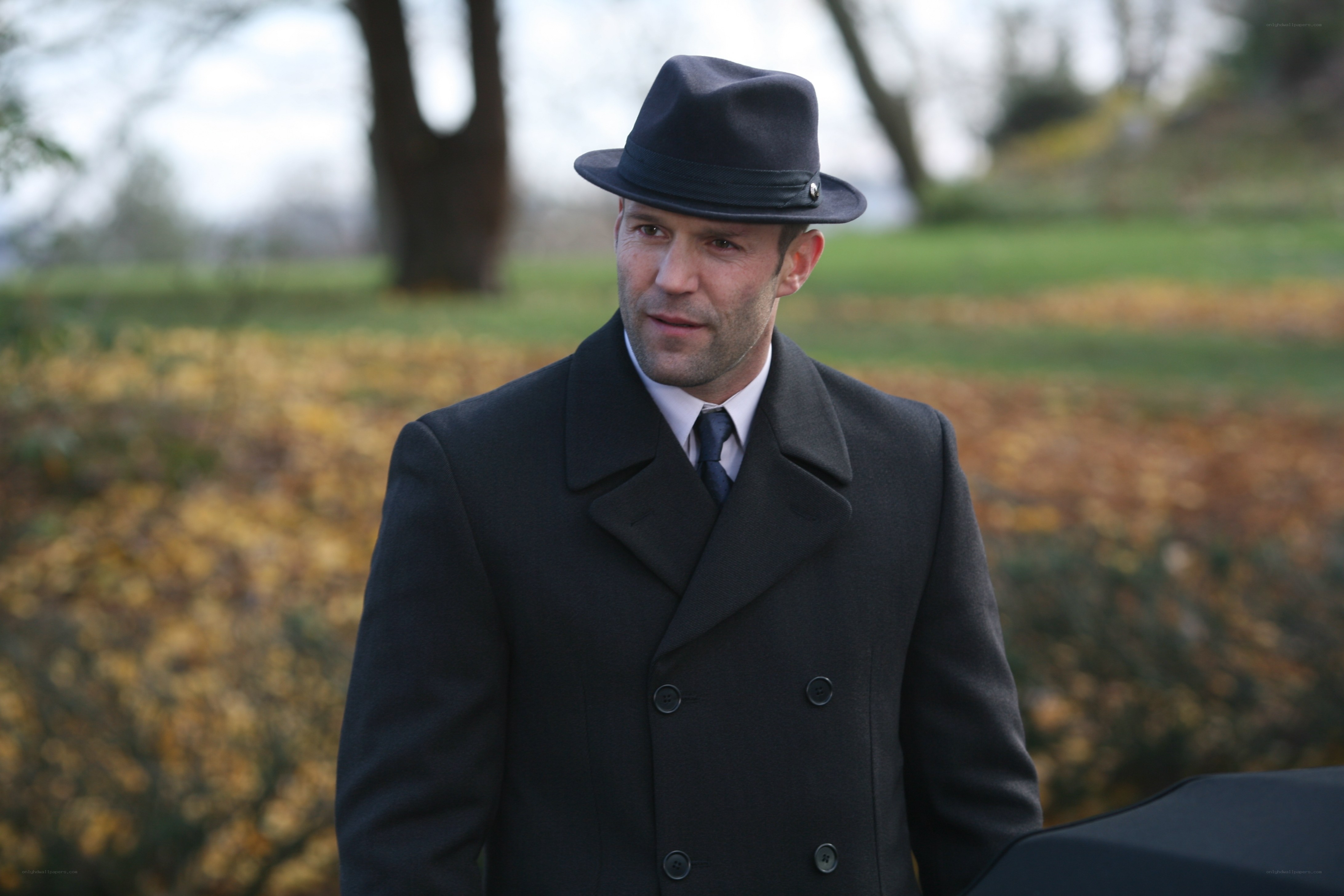 man in coat and hat