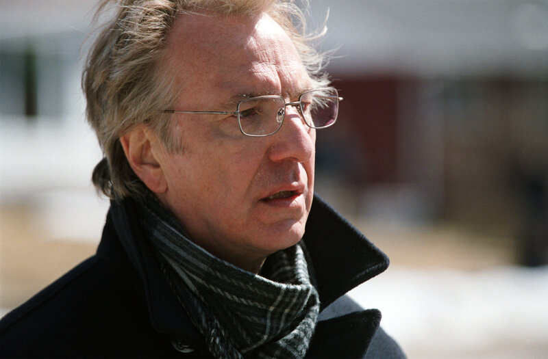 man in coat and scarf