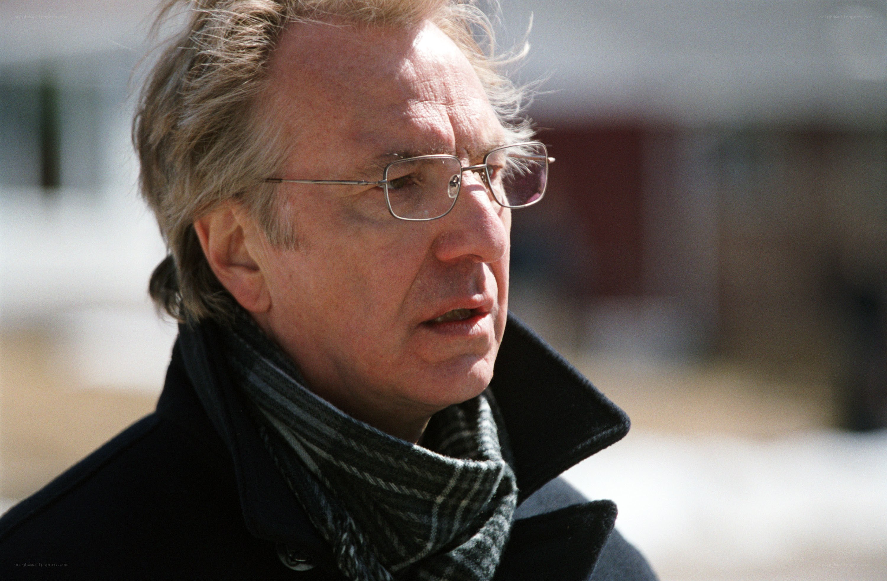 man in coat and scarf