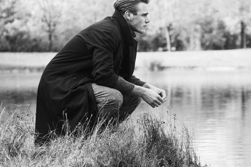Man in Coat by Water