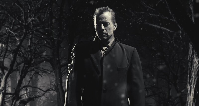 man in coat during snowfall