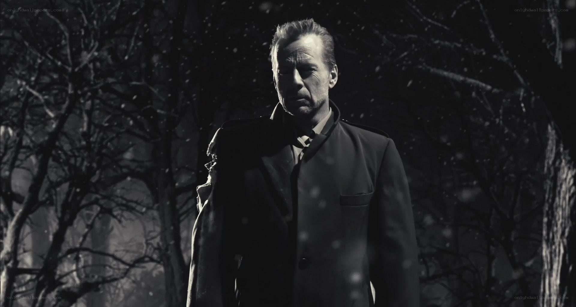 man in coat during snowfall