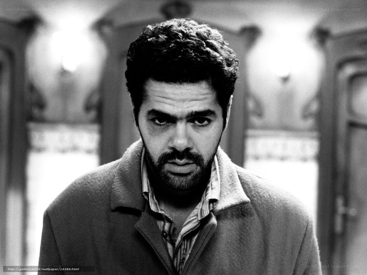 man in coat looking at camera