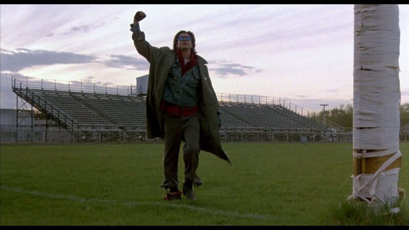 Man in Coat on Field