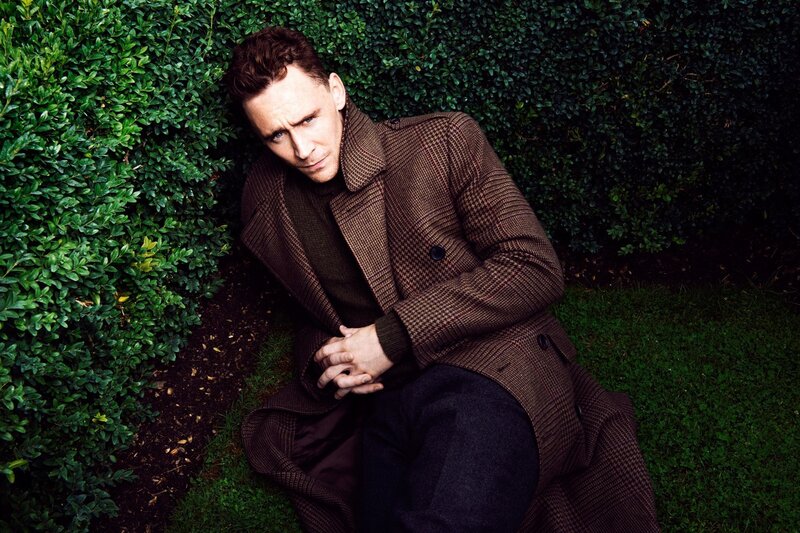 man in coat on grass