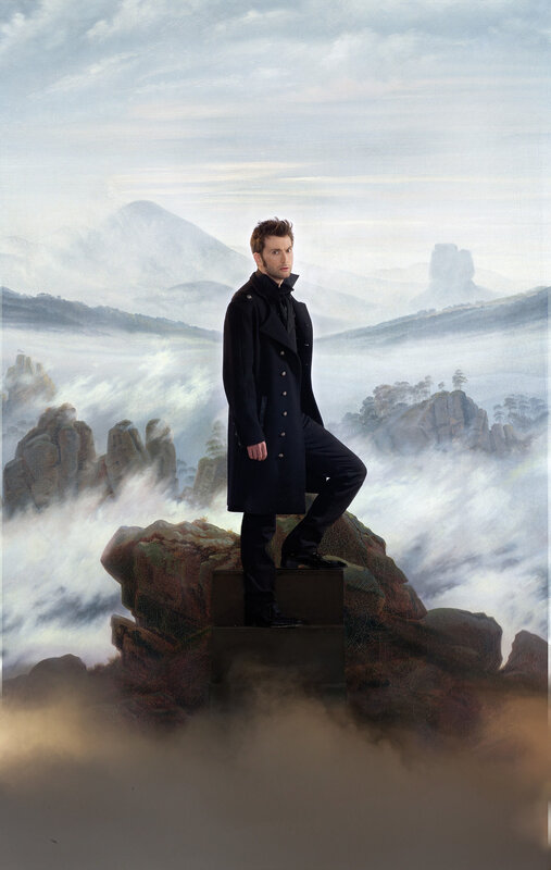 man in coat on rocky outcrop