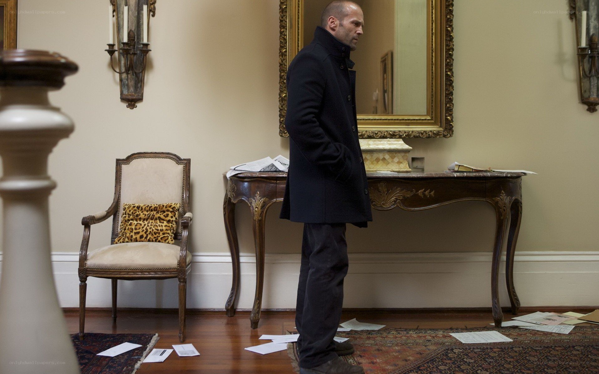 Man in coat standing in hallway