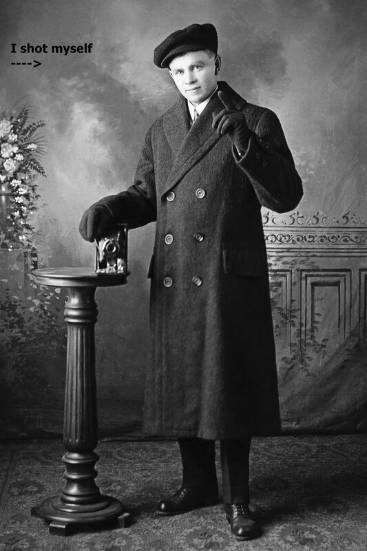 Man in coat with camera