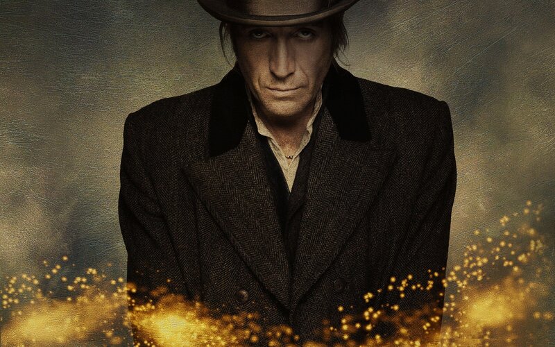 man in coat with golden sparks