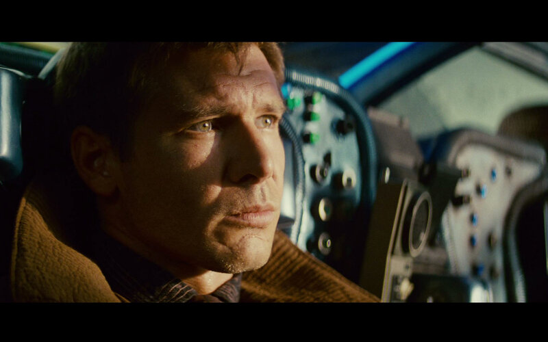man in cockpit looking forward