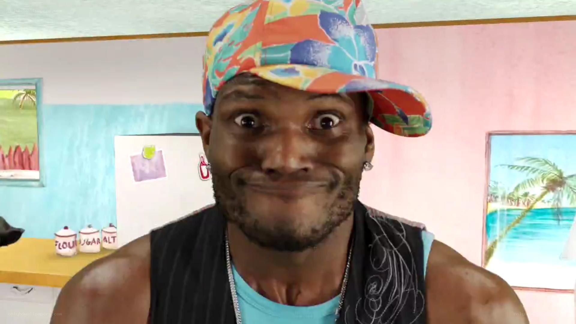 man in colorful hat smiling