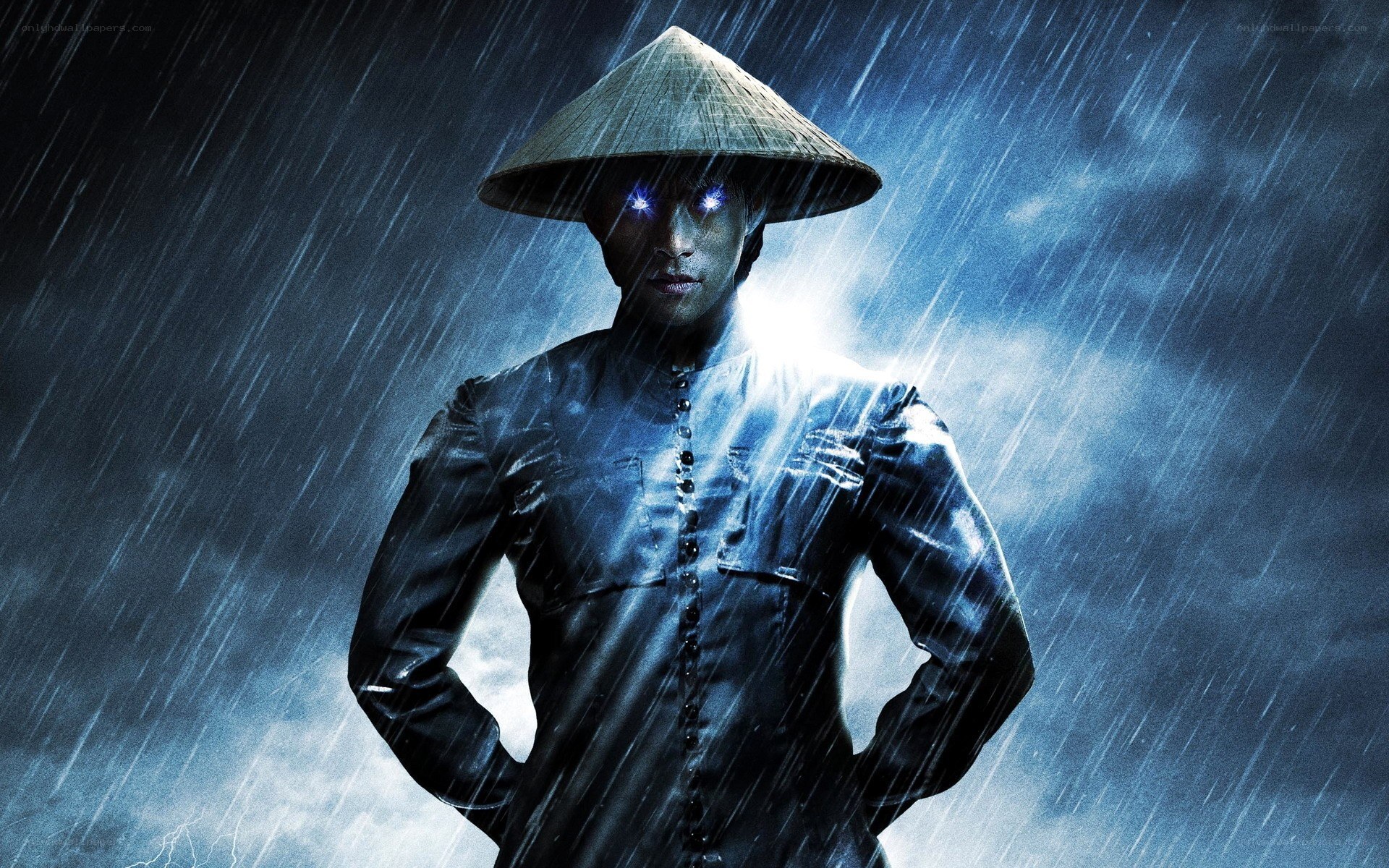 man in conical hat in rain