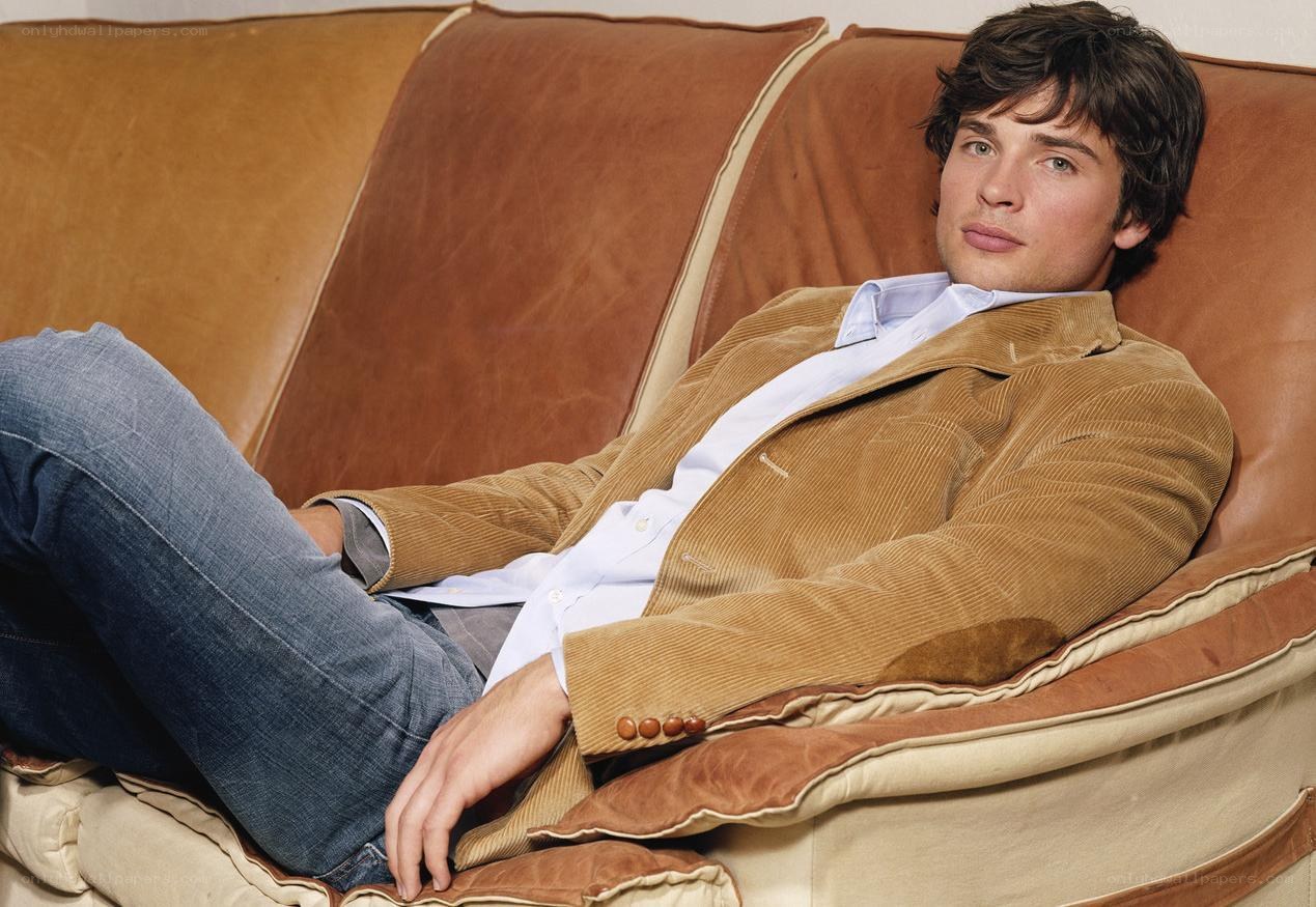 Man in corduroy jacket on sofa