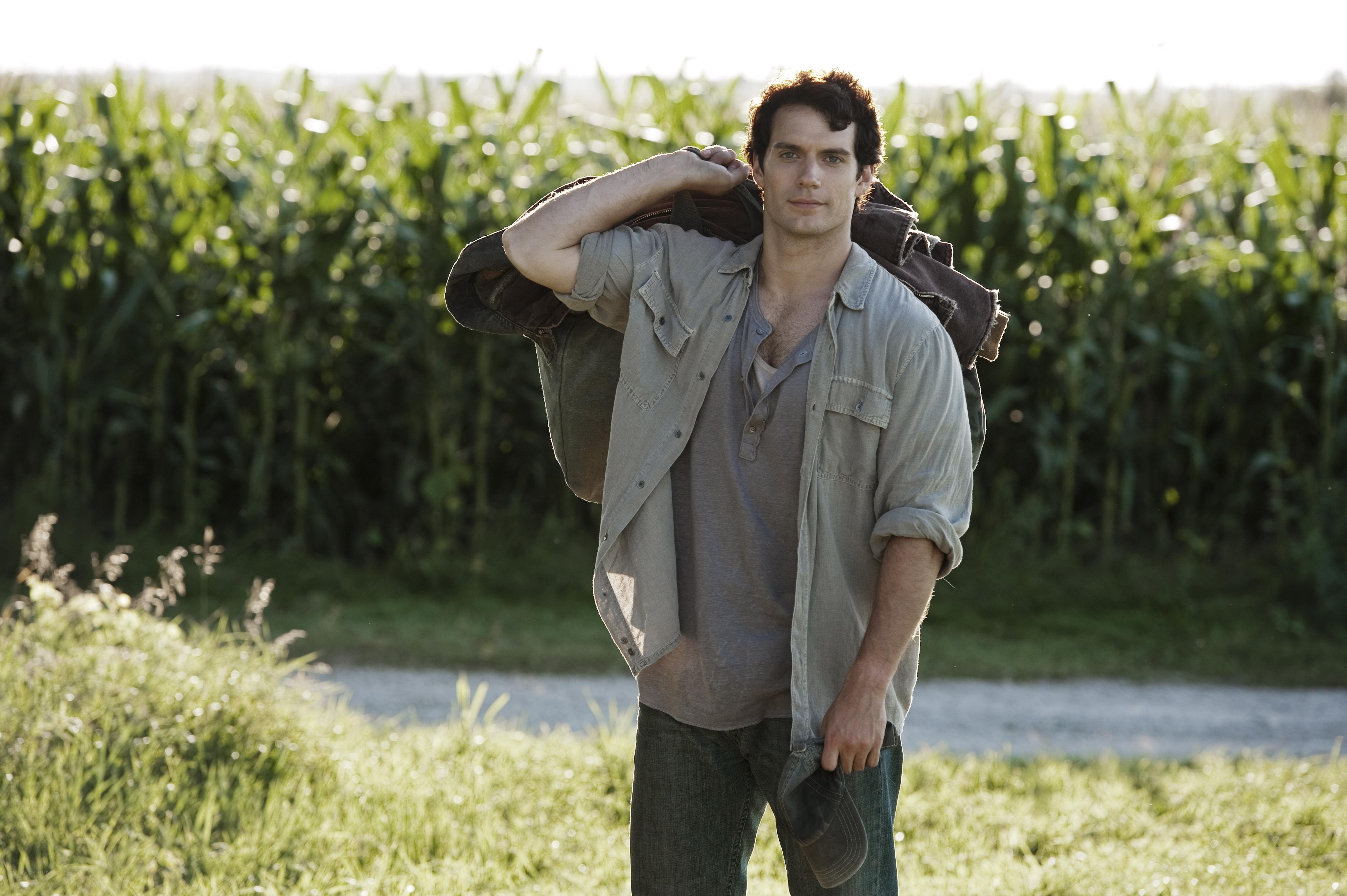 man in cornfield with backpack