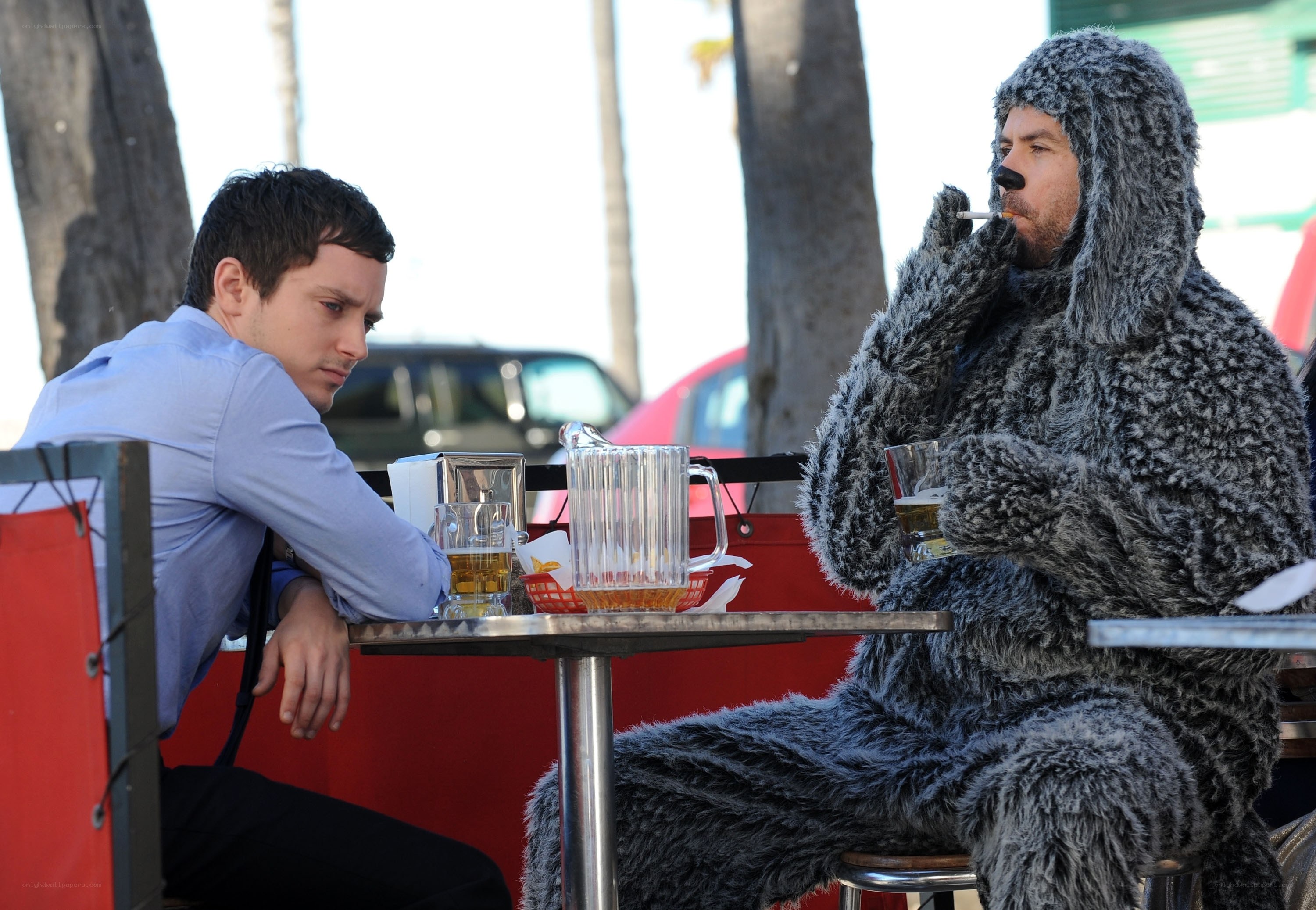 Man in costume at outdoor table