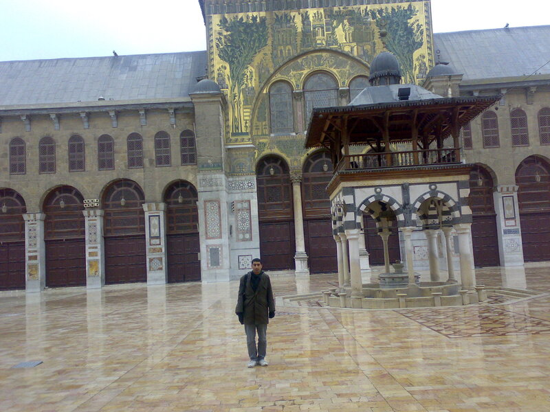 Man in courtyard with fountain