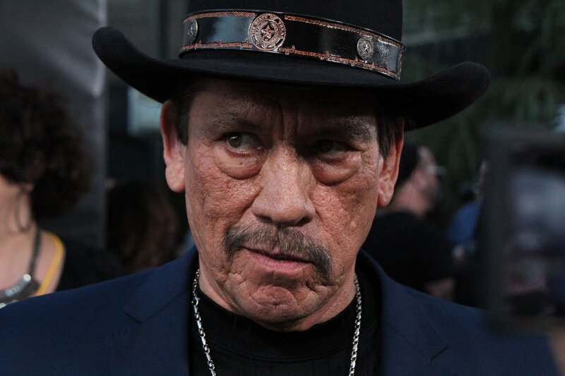man in cowboy hat and suit