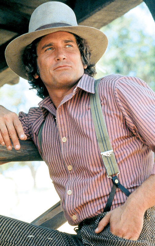 man in cowboy hat and suspenders