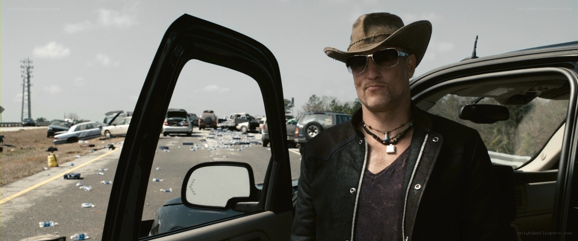 Man in cowboy hat at accident scene