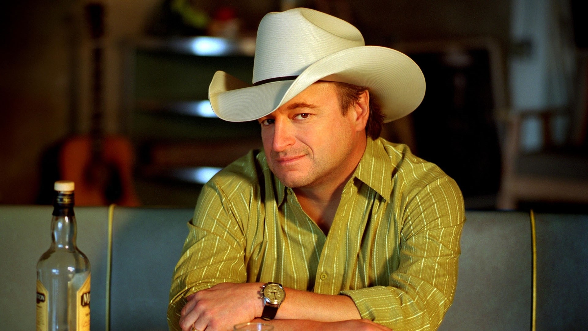 man in cowboy hat at bar