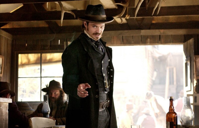 Man in cowboy hat at saloon
