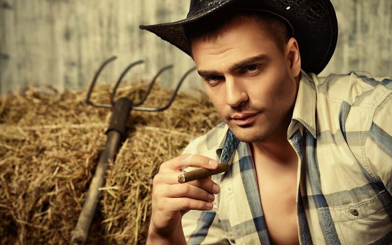 Man in Cowboy Hat — Brown, Dramatic, Photograph, Cigar