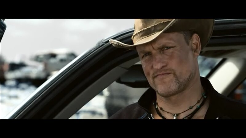 man in cowboy hat in car