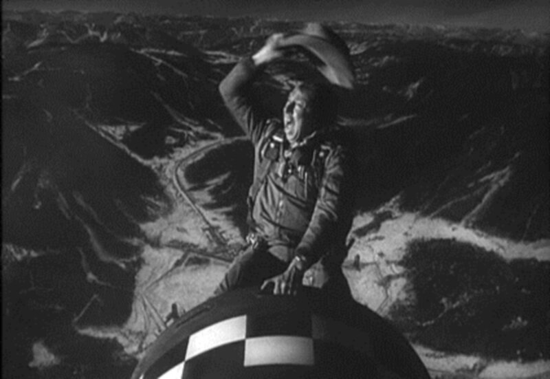 man in cowboy hat on aircraft