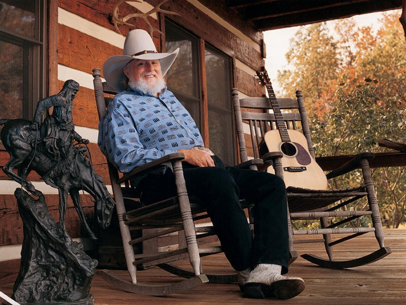 Man in cowboy hat on porch