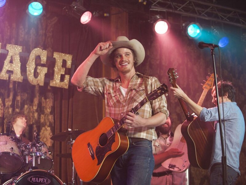 Man in Cowboy Hat on Stage — Brown