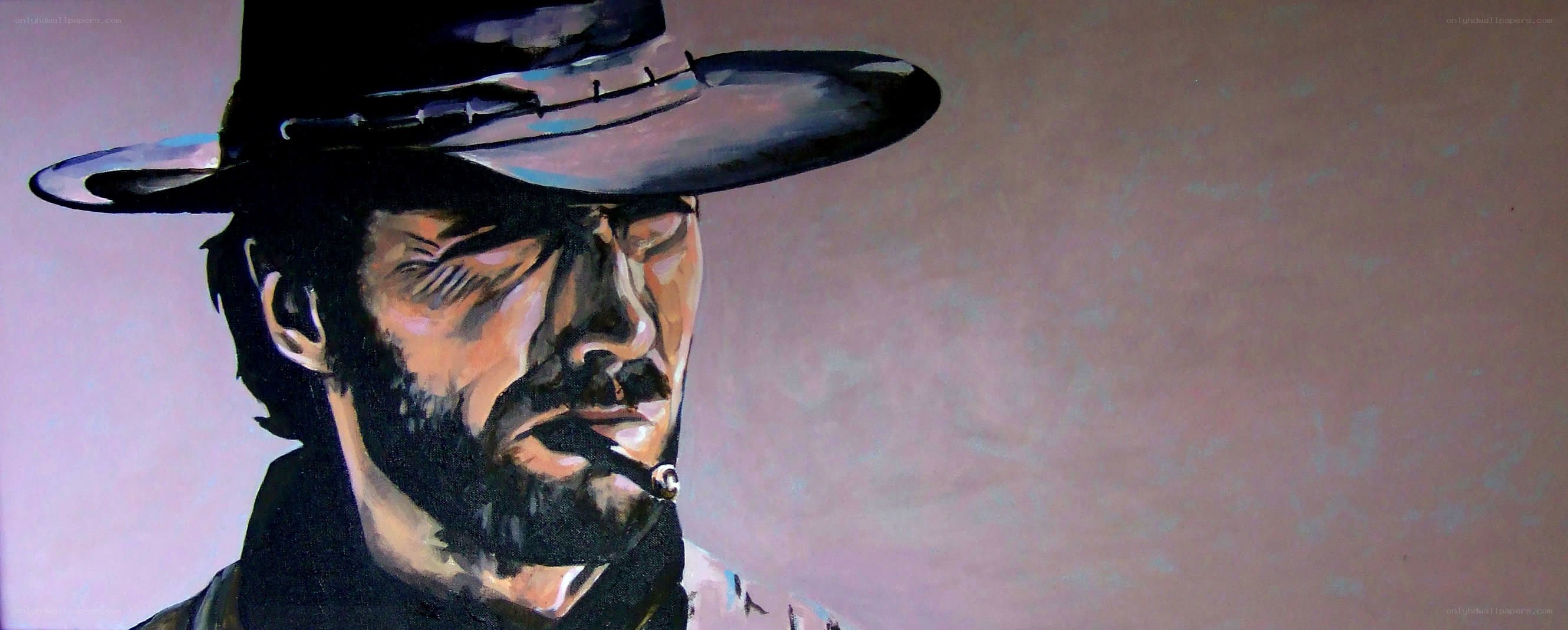 man in cowboy hat painting