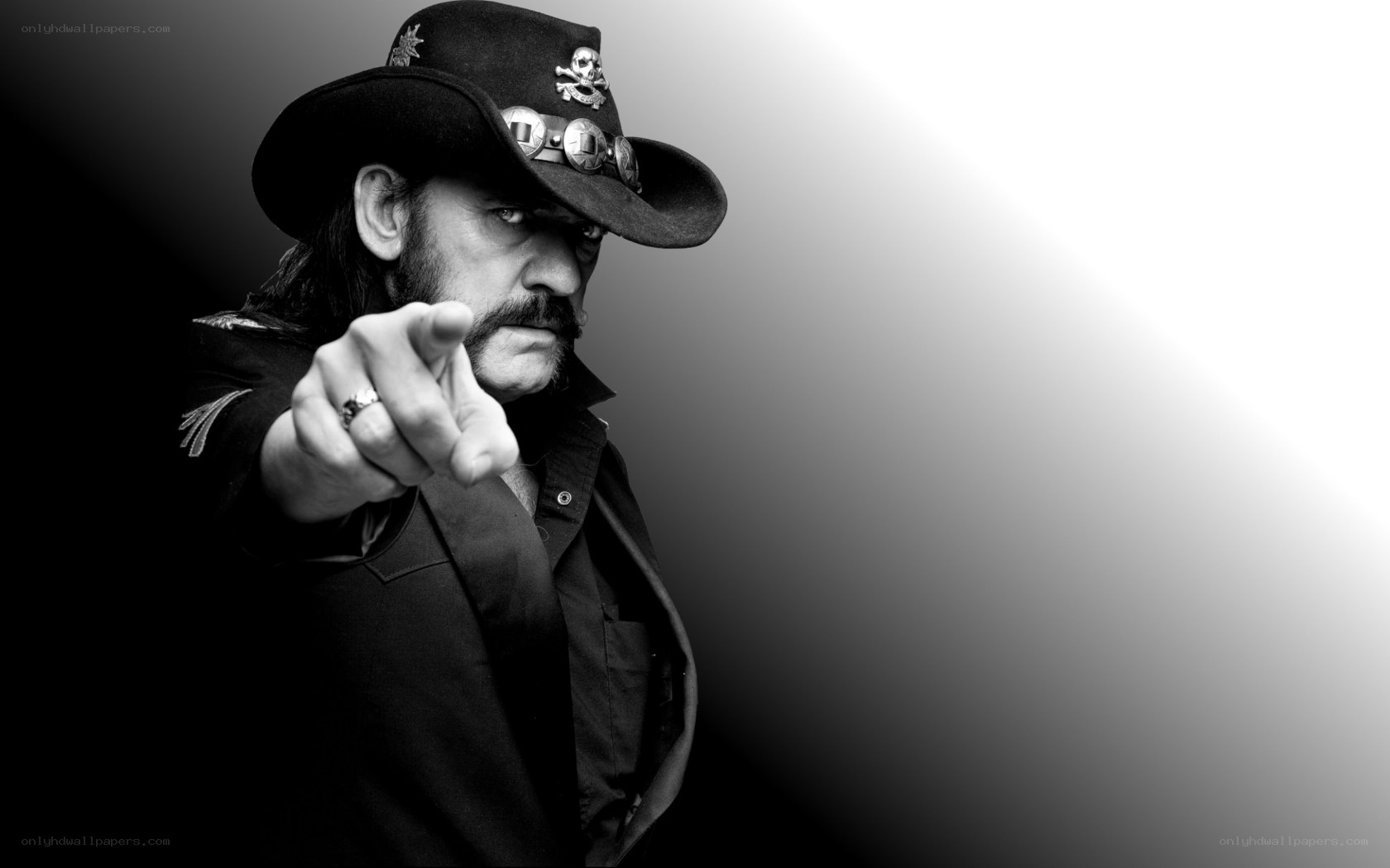 Man in cowboy hat pointing