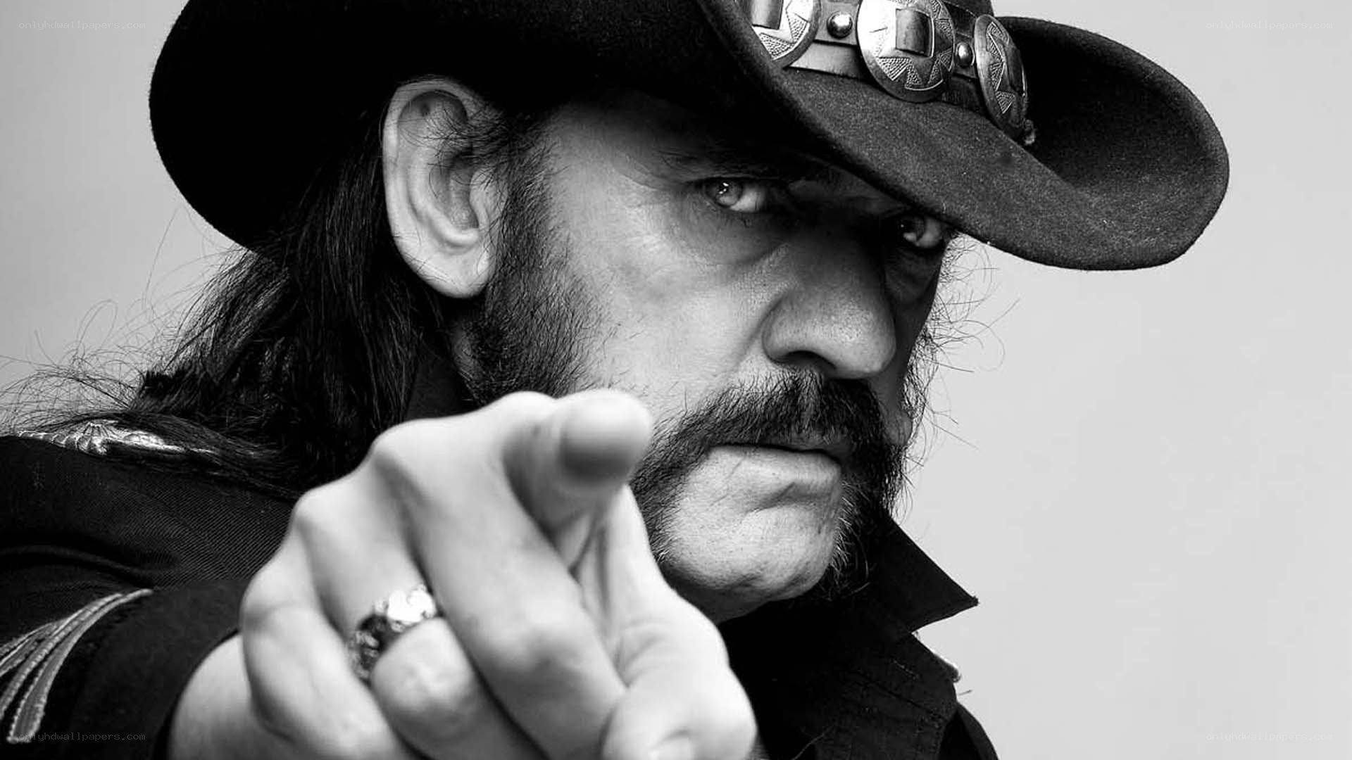 man in cowboy hat pointing