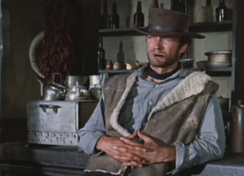 man in cowboy hat sitting