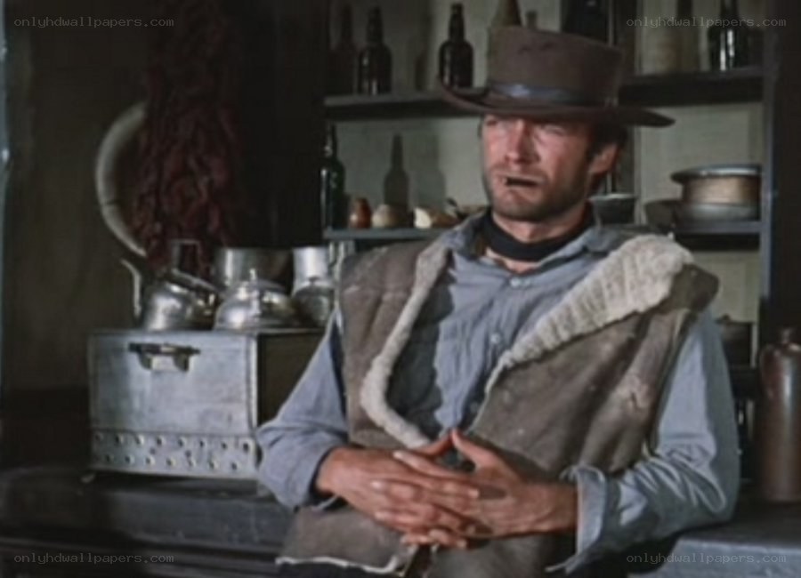 man in cowboy hat sitting