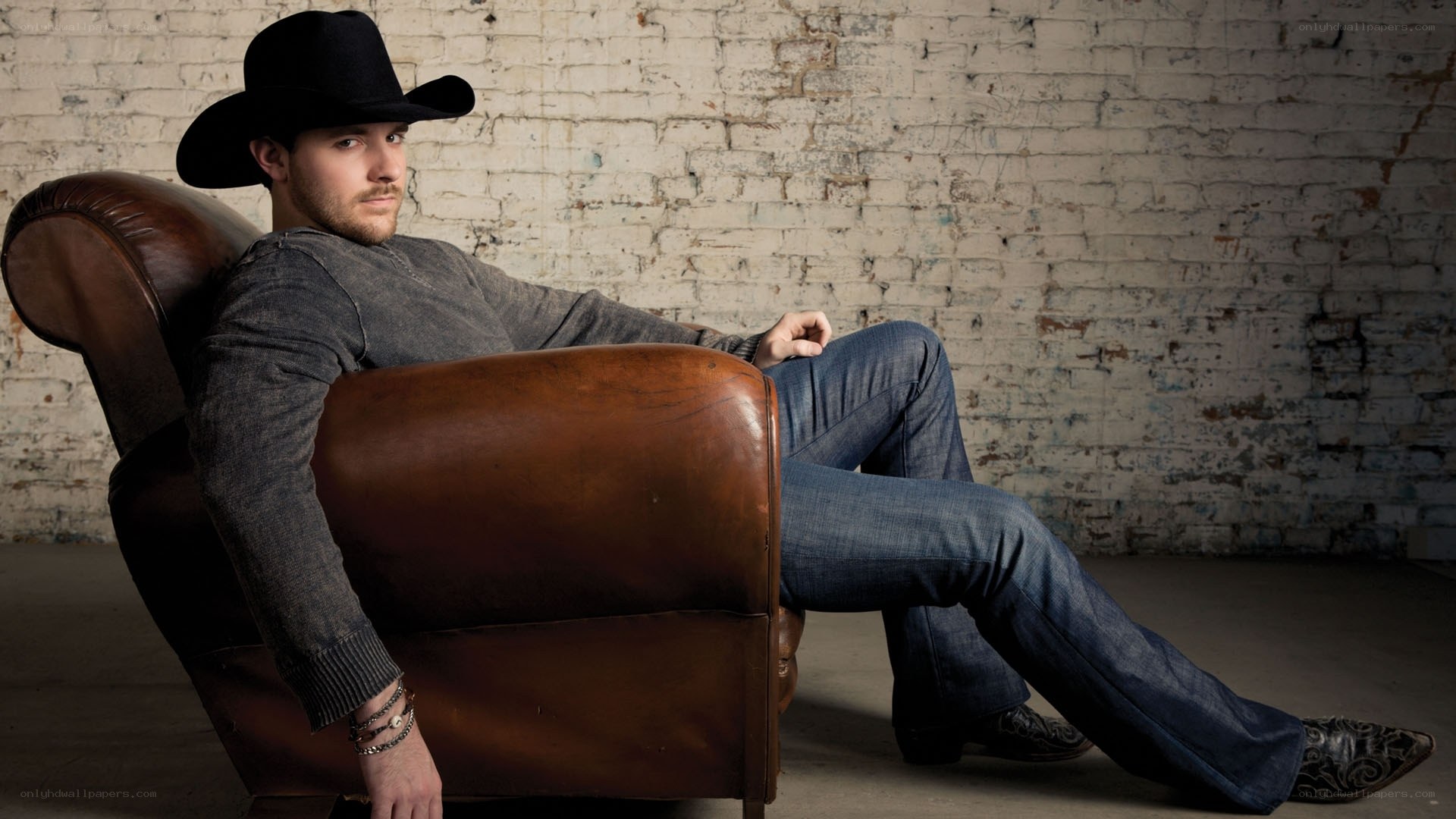 man in cowboy hat sitting