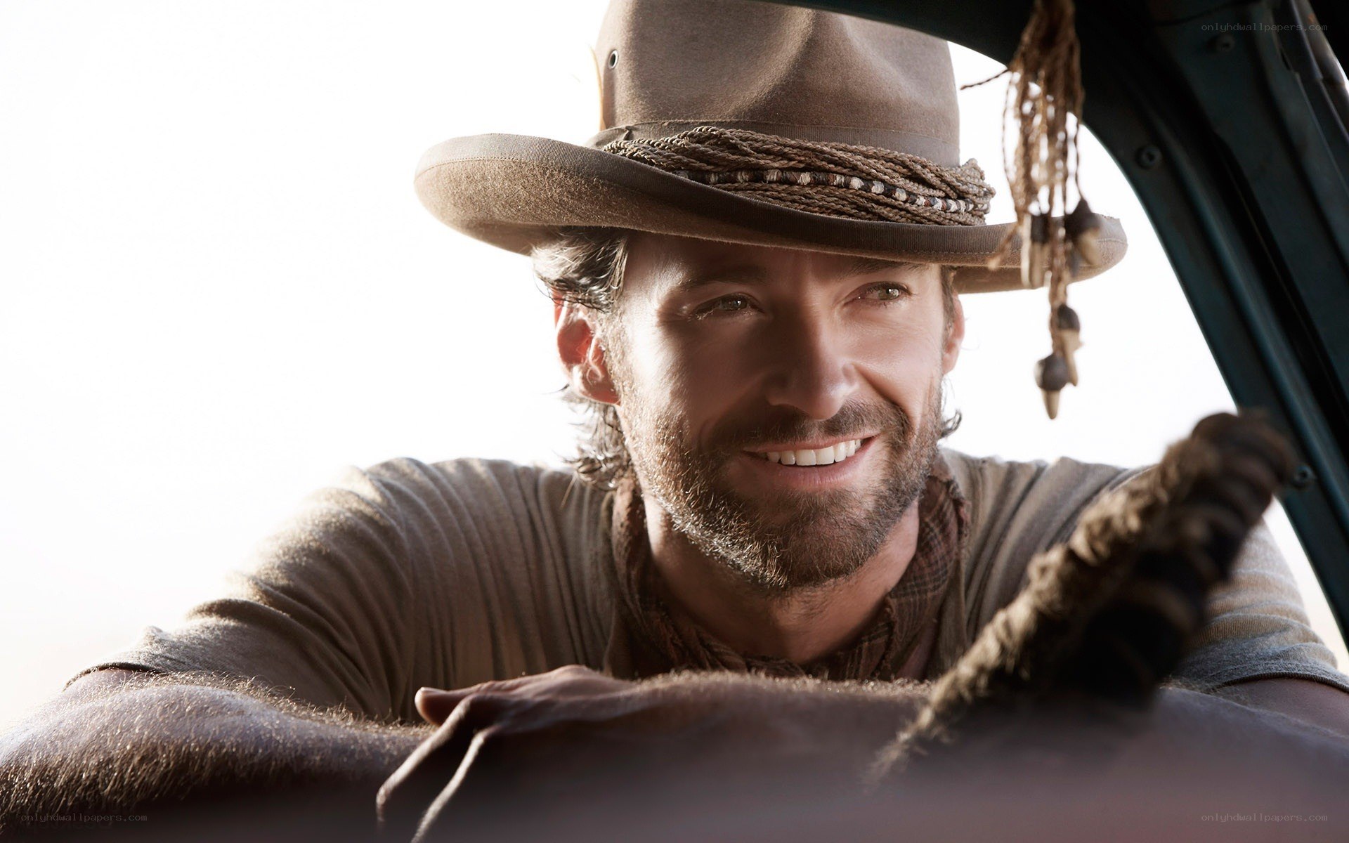 man in cowboy hat smiling