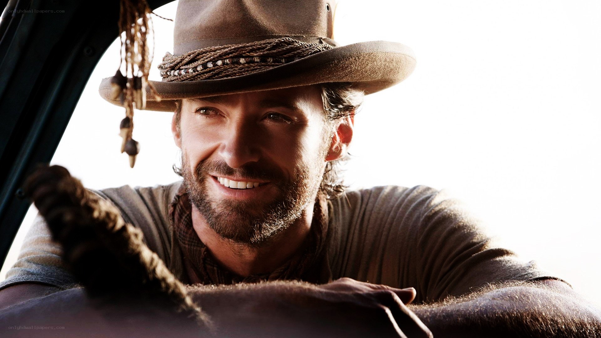 man in cowboy hat smiling