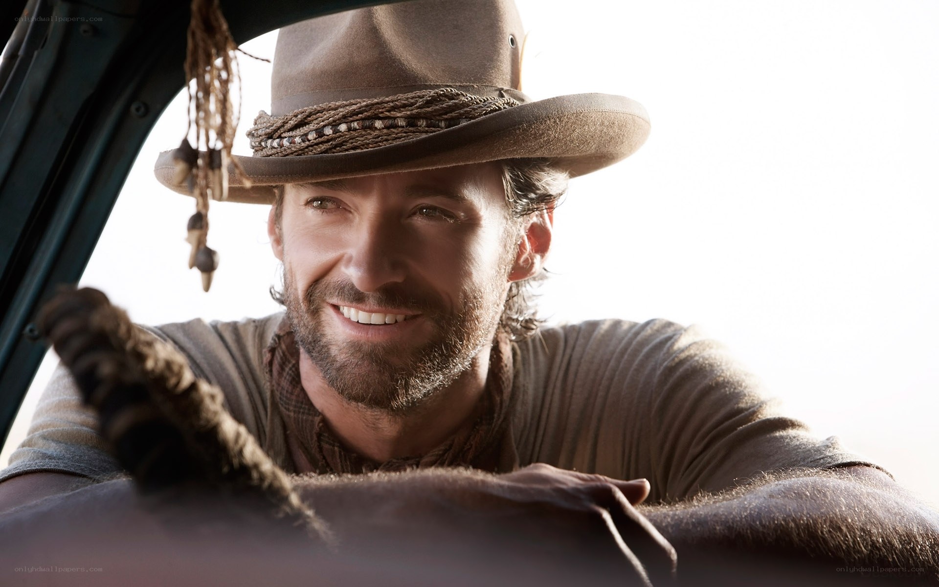 man in cowboy hat smiling