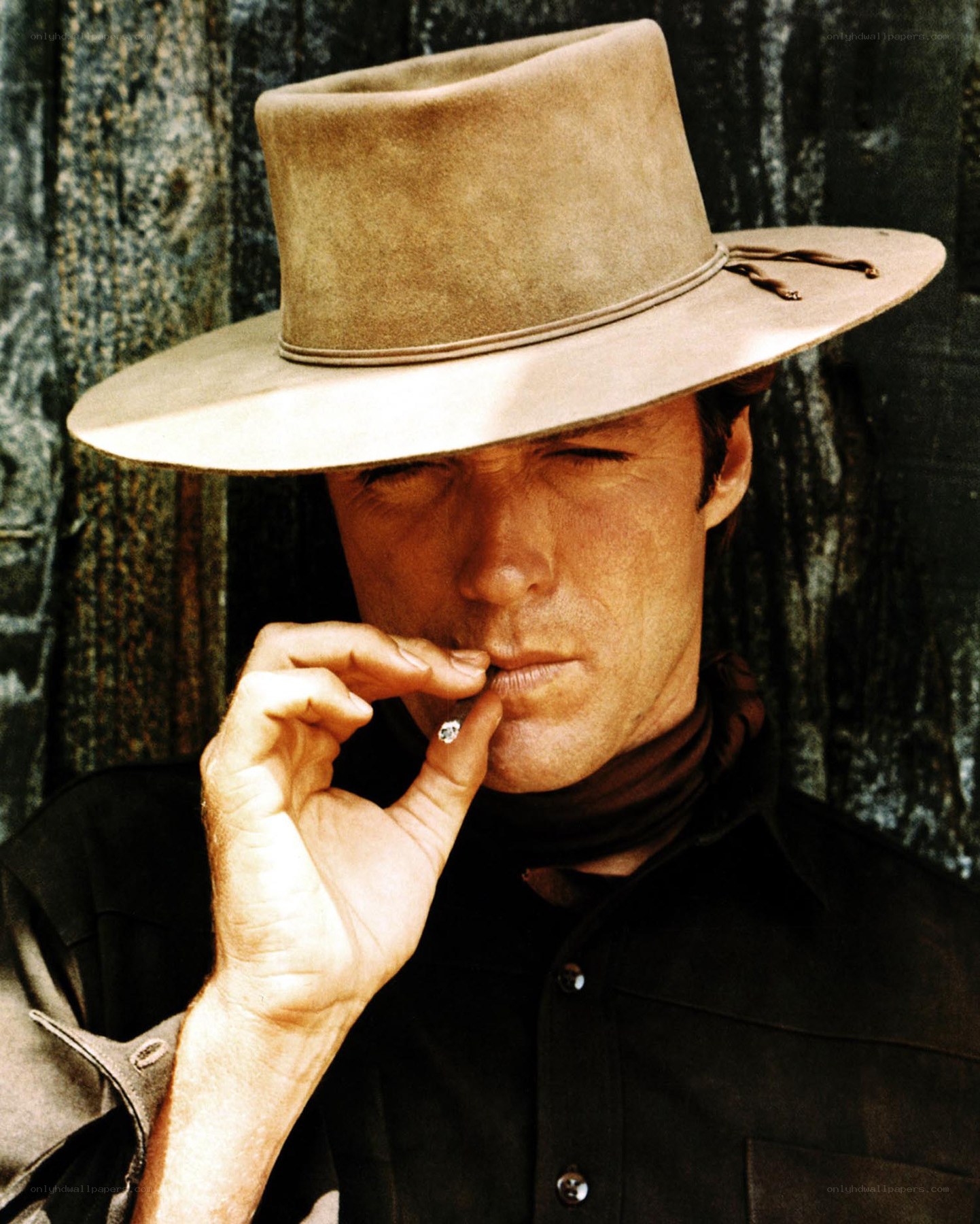 man in cowboy hat smoking