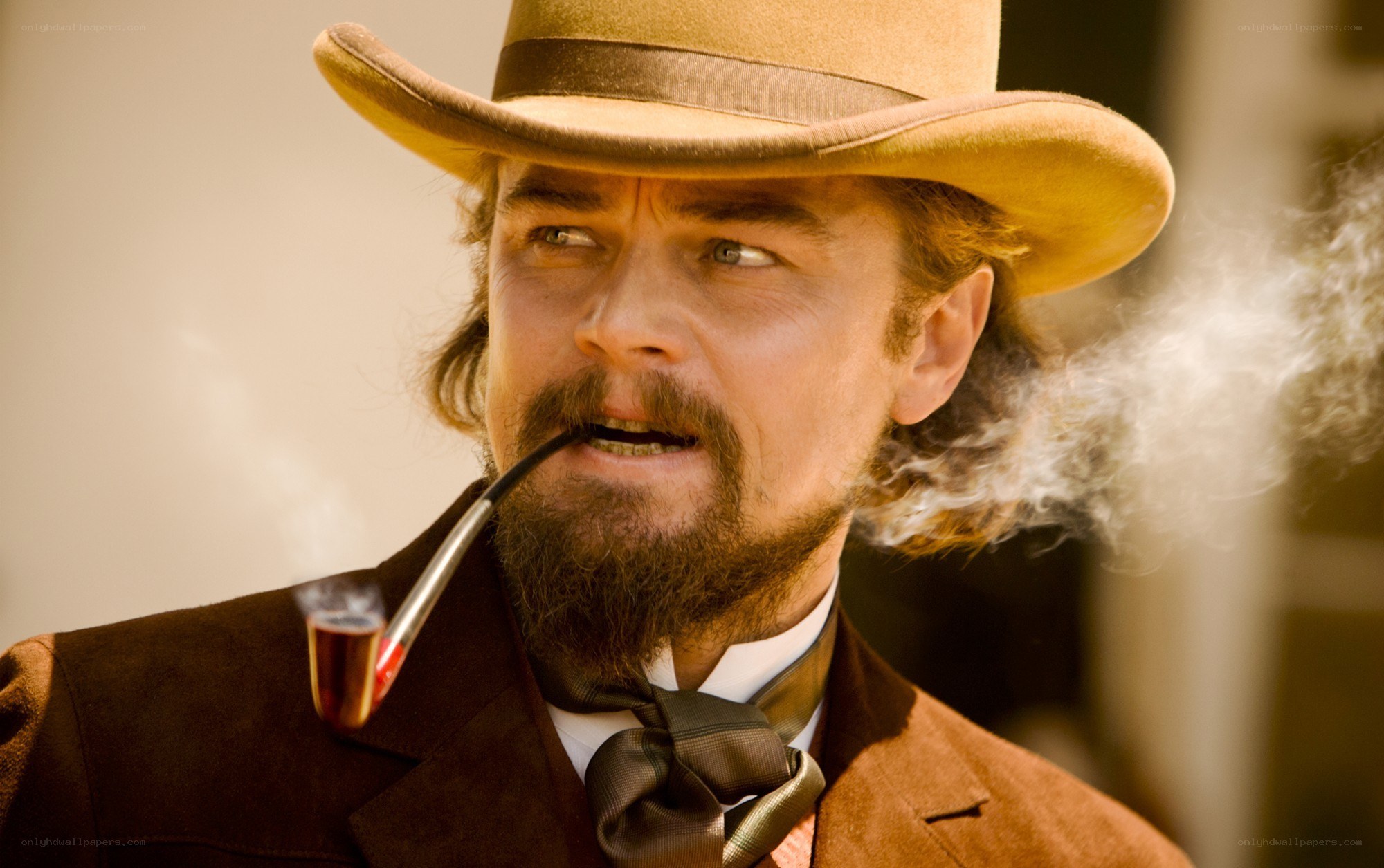 man in cowboy hat smoking pipe