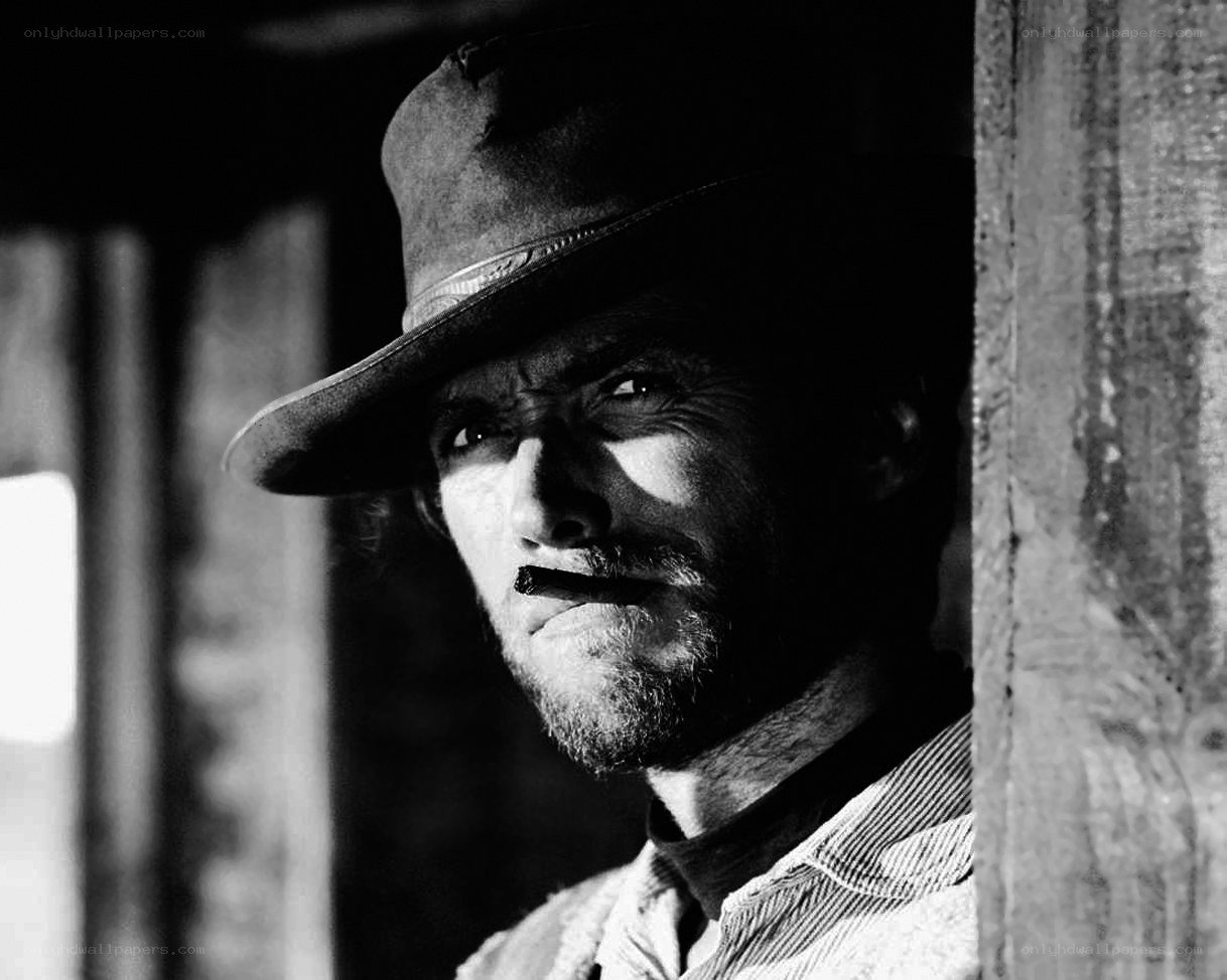 man in cowboy hat with cigar