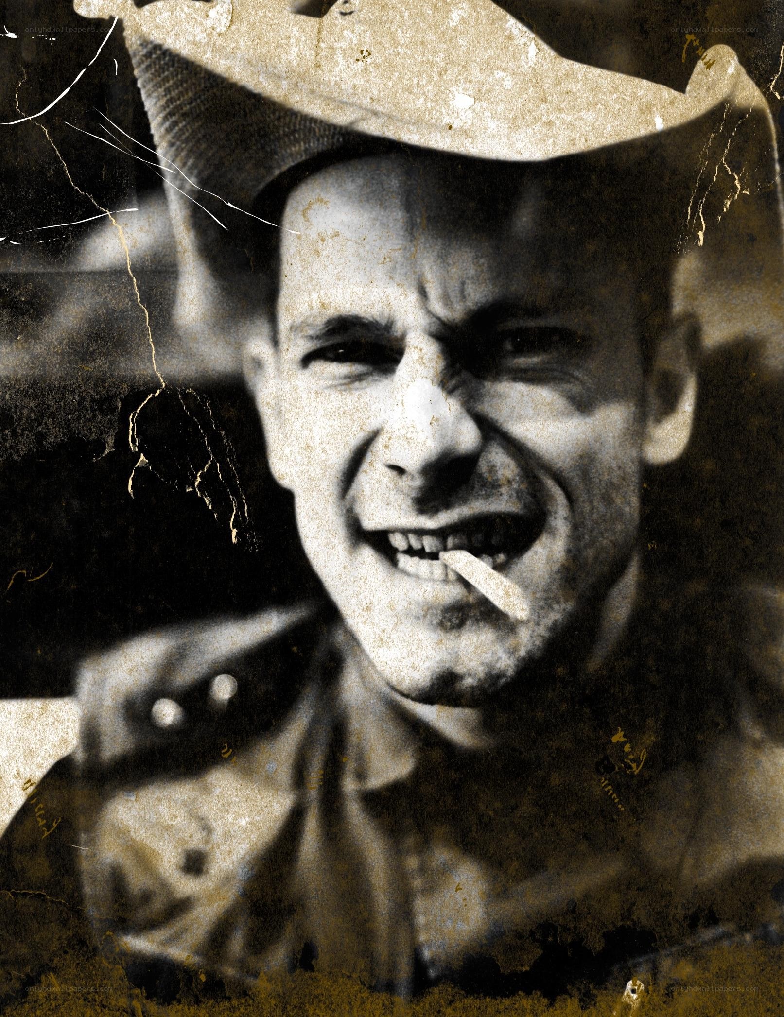 man in cowboy hat with cigarette