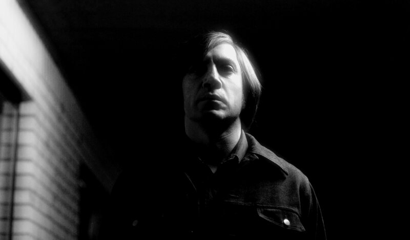 man in dark alley