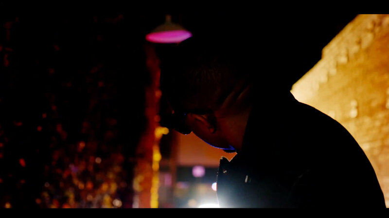 man in dark alley at night