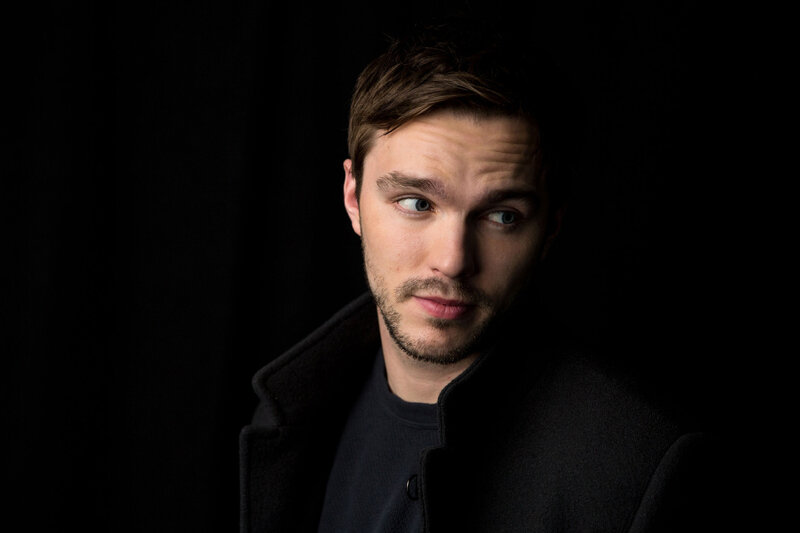 man in dark coat looking sideways